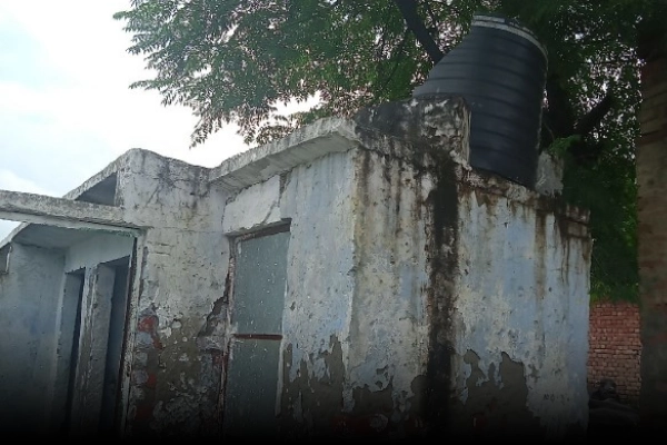 Image depicting the condition of an educational facility before development, highlighting the need for better infrastructure and resources.