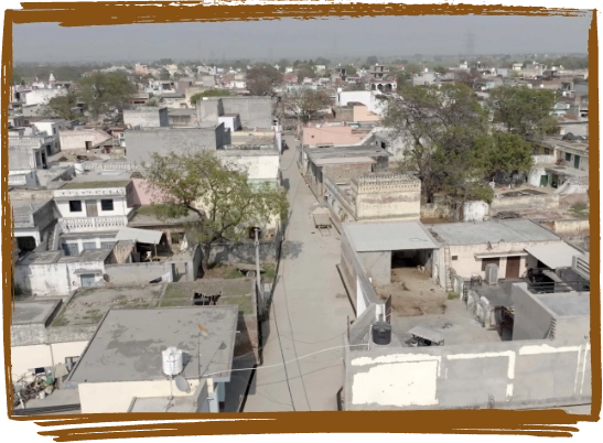 Image showing villagers using an all-weather road, reflecting improved mobility and economic growth.