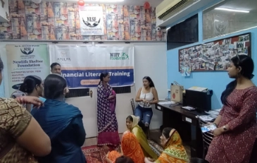 Women participating in a financial literacy training session organized by Atulya Foundation, empowering them with economic knowledge and skills.