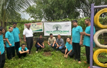 Group of volunteers participating in a tree plantation drive organized by Atulya Foundation, promoting environmental sustainability and green initiatives.